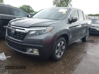 2018 Honda Ridgeline RTL-E with VIN 5FPYK3F74JB012181, listed as a IAAI auction lot 42143197 with 117,520 mi miles and . Bid and sale history available at DreamBid. Image 2.