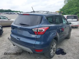2018 Ford Escape Titanium with VIN 1FMCU0J99JUA12717, listed as a IAAI auction lot 42237509 with 123,896 mi miles and . Bid and sale history available at DreamBid. Image 4.