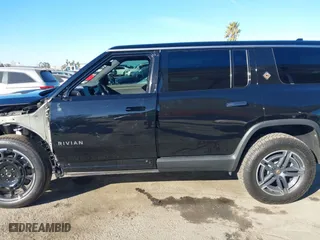 2025 Rivian R1S Adventure with VIN 7PDSGBBA4SN047584, listed as a IAAI auction lot 41372645 with 501 mi miles. Bid and sale history available at carsss.com. Image 15.