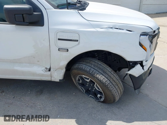 2023 Ford F-150 Lightning Pro with VIN 1FTVW1EL2PWG18764, listed as a IAAI auction lot 41908278 with 16,276 mi miles and . Bid and sale history available at DreamBid. Image 19.