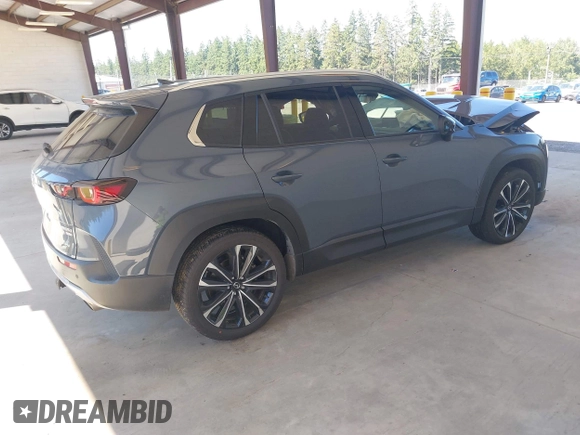 2023 Mazda CX-50 Premium Plus with VIN 7MMVABEY8PN100311, listed as a IAAI auction lot 42626276 with 40,242 mi miles and . Bid and sale history available at DreamBid. Image 4.