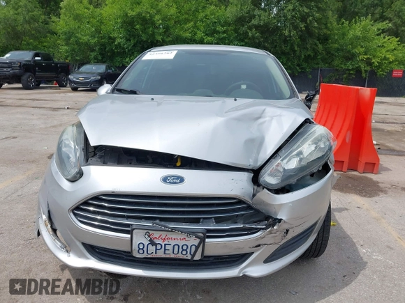 2018 Ford Fiesta SE z VIN 3FADP4BJ6JM106855, wystawiony jako IAAI lot #42491262 z przebiegiem 166 397 mil mil oraz . Historia ofert i sprzedaży dostępna na DreamBid. Obrazek 6.