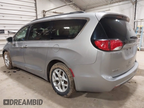 2017 Chrysler Pacifica Touring L with VIN 2C4RC1BG7HR831320, listed as a IAAI auction lot 41805697 with 137,743 mi miles and . Bid and sale history available at DreamBid. Image 3.