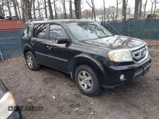 2011 Honda Pilot Touring z VIN 5FNYF3H95BB005169, wystawiony jako IAAI lot #41910263 z przebiegiem 161 704 mil mil oraz . Historia ofert i sprzedaży dostępna na DreamBid. Obrazek 1.