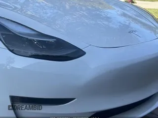 2023 Tesla Model 3 z VIN 5YJ3E1EA4PF555051, wystawiony jako IAAI lot #41500331 z przebiegiem 11 810 mil mil oraz . Historia ofert i sprzedaży dostępna na DreamBid. Obrazek 6.