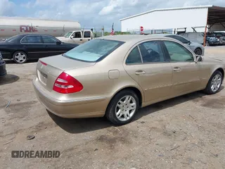 2003 Mercedes-Benz E-Class 3.2L with VIN WDBUF65J23A243178, listed as a IAAI auction lot 41974660 with 134,459 mi miles. Bid and sale history available at carsss.com. Image 4.