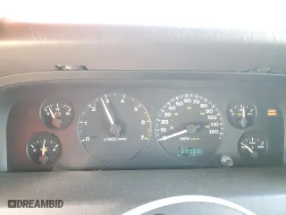 1999 Jeep Grand Cherokee Laredo with VIN 1J4GW58NXXC776438, listed as a Copart auction lot 84412044 with 163,060 mi miles and Salvage Title. Bid and sale history available at carsss.com. Image 9.