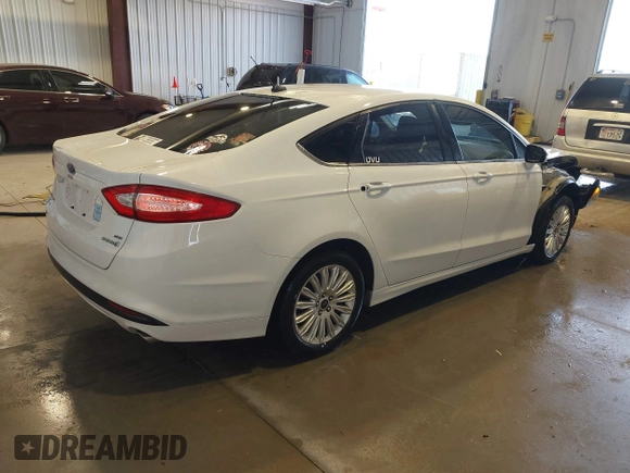 2013 Ford Fusion SE Hybrid with VIN 3FA6P0LU5DR303873, listed as a IAAI auction lot 41074370 with 193,372 mi miles and . Bid and sale history available at DreamBid. Image 4.