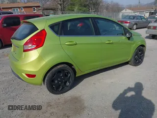 2011 Ford Fiesta SES with VIN 3FADP4FJ4BM108857, listed as a IAAI auction lot 41848272 with 138,943 mi miles. Bid and sale history available at carsss.com. Image 4.