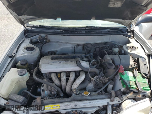 1999 Toyota Corolla VE z VIN 2T1BR12E3XC107587, wystawiony jako Copart lot #62314265 z przebiegiem 143 734 mil mil oraz Szkoda całkowita • Salvage title. Historia ofert i sprzedaży dostępna na DreamBid. Obrazek 11.