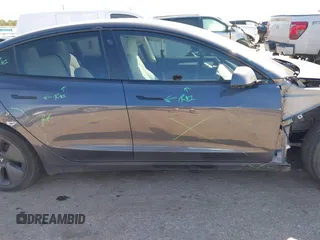 2022 Tesla Model 3 with VIN 5YJ3E1EAXNF326354, listed as a IAAI auction lot 41651872 with 27,922 mi miles and . Bid and sale history available at DreamBid. Image 14.