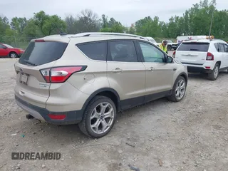 2018 Ford Escape Titanium with VIN 1FMCU9J94JUA44964, listed as a IAAI auction lot 42494471 with 100,955 mi miles and . Bid and sale history available at DreamBid. Image 4.