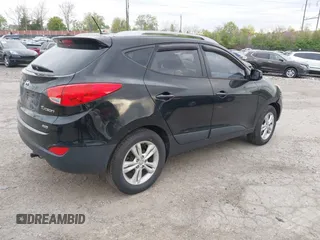 2011 Hyundai Tucson Limited with VIN KM8JUCACXBU293660, listed as a IAAI auction lot 42051931 with 99,995 mi miles and . Bid and sale history available at DreamBid. Image 4.