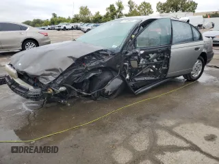 1999 Saturn SL with VIN 1G8ZF5281XZ252460, listed as a Copart auction lot 71125634 with 0 mi miles and Salvage Title. Bid and sale history available at carsss.com. Image 1.