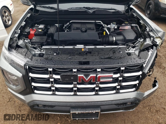 2024 GMC Canyon 4WD AT4 z VIN 1GTP6DEK8R1306627, wystawiony jako Copart lot #80921614 z przebiegiem 6 mil mil oraz Szkoda całkowita • Salvage title. Historia ofert i sprzedaży dostępna na DreamBid. Obrazek 11.
