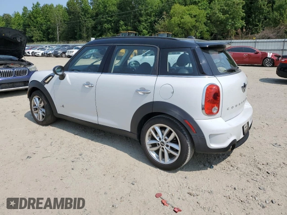 2014 MINI Countryman S with VIN WMWZC5C5XEWP37128, listed as a Copart auction lot 59549885 with 84,121 mi miles and Salvage title. Bid and sale history available at DreamBid. Image 2.