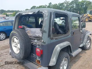 2001 Jeep Wrangler Sport with VIN 1J4FA49S91P330175, listed as a IAAI auction lot 40133432 with 999,999 mi miles. Bid and sale history available at carsss.com. Image 6.