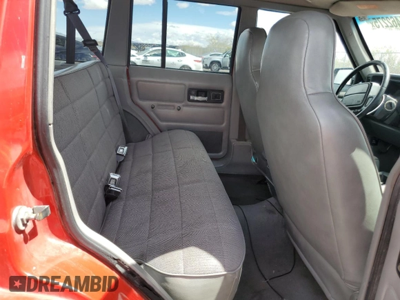 1996 Jeep Cherokee Sport with VIN 1J4FJ68S6TL213886, listed as a Copart auction lot 51462275 with 215,091 mi miles and Salvage title. Bid and sale history available at DreamBid. Image 11.