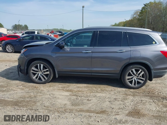 2017 Honda Pilot Touring with VIN 5FNYF5H9XHB046479, listed as a IAAI auction lot 41941449 with 162,554 mi miles. Bid and sale history available at carsss.com. Image 14.