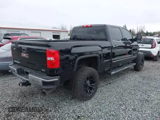 2018 GMC Sierra 2500HD SLT with VIN 1GT12TEY4JF203731, listed as a IAAI auction lot 41858306 with 86,931 mi miles. Bid and sale history available at carsss.com. Image 4.