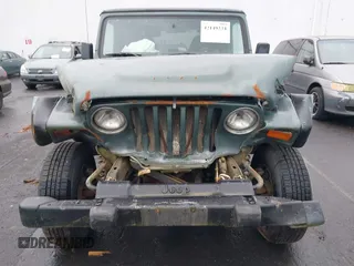 1999 Jeep Wrangler Sport with VIN 1J4FY19S6XP428003, listed as a IAAI auction lot 42149234 with 1 mi miles. Bid and sale history available at carsss.com. Image 6.