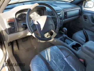 1999 Jeep Grand Cherokee Laredo with VIN 1J4GW58NXXC776438, listed as a Copart auction lot 84412044 with 163,060 mi miles and Salvage title. Bid and sale history available at DreamBid. Image 8.