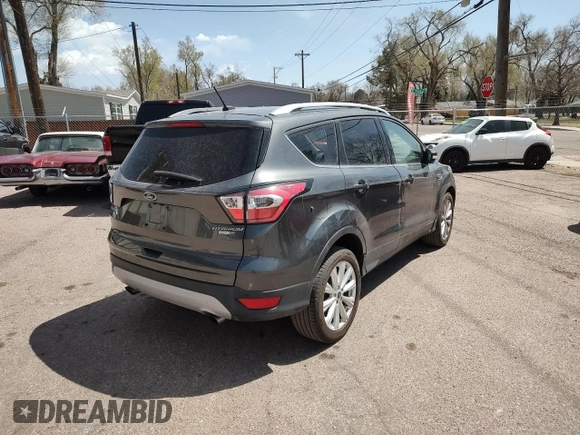 2017 Ford Escape Titanium with VIN 1FMCU9JD0HUC09357, listed as a Copart auction lot 52772915 with 99,062 mi miles and Clean Title. Bid and sale history available at carsss.com. Image 4.