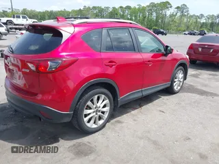 2014 Mazda CX-5 Grand Touring with VIN JM3KE2DY3E0382920, listed as a IAAI auction lot 42102876 with 324,608 mi miles. Bid and sale history available at carsss.com. Image 4.