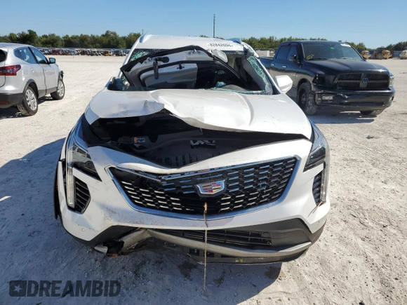2020 Cadillac XT4 FWD Premium Luxury z VIN 1GYFZCR48LF128683, wystawiony jako Copart lot #49591405 z przebiegiem Nie podano mil oraz Szkody całkowita. Historia ofert i sprzedaży dostępna na DreamBid. Obrazek 5.