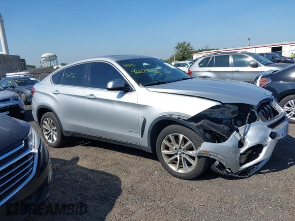 2018 BMW X6 xDrive35i z VIN 5UXKU2C51J0X50507, wystawiony jako IAAI lot #40275236 z przebiegiem 67 523 mil mil oraz . Historia ofert i sprzedaży dostępna na DreamBid. Obrazek 13.
