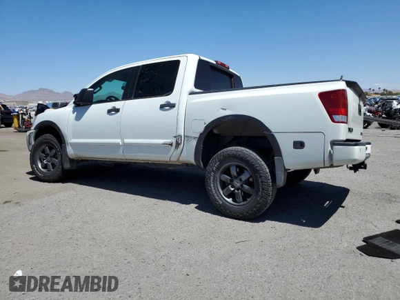 2015 Nissan Titan Pro-4X z VIN 1N6AA0EC9FN512658, wystawiony jako Copart lot #68066964 z przebiegiem 131 026 mil mil oraz Szkoda całkowita • Salvage title. Historia ofert i sprzedaży dostępna na DreamBid. Obrazek 2.