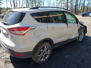 2016 Ford Escape SE with VIN 1FMCU0G9XGUB90670, listed as a IAAI auction lot 41694382 with 167,631 mi miles. Bid and sale history available at carsss.com. Image 4.