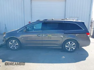 2014 Honda Odyssey Touring with VIN 5FNRL5H97EB101169, listed as a IAAI auction lot 41869233 with 142,147 mi miles and . Bid and sale history available at DreamBid. Image 15.