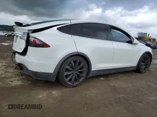 2016 Tesla Model X 70D with VIN 5YJXCAE28GF017100, listed as a Copart auction lot 50081235 with 126,962 mi miles and Salvage Title. Bid and sale history available at DreamBid. Image 3.