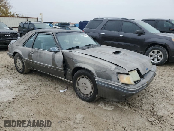 1986 Ford Mustang with VIN 1FABP28T8GF109009, listed as a Copart auction lot 83148544 with 329,005 mi miles and Salvage title. Bid and sale history available at DreamBid. Image 4.