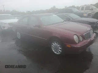 2002 Mercedes-Benz E 320 with VIN WDBJF82J22X070566, listed as a Copart auction lot 55964535 with 238,240 mi miles and Salvage Title. Bid and sale history available at DreamBid. Image 4.