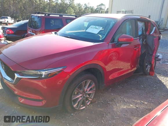 2020 Mazda CX-5 Grand Touring with VIN JM3KFADM8L0846818, listed as a IAAI auction lot 41224843 with 123,554 mi miles. Bid and sale history available at carsss.com. Image 2.