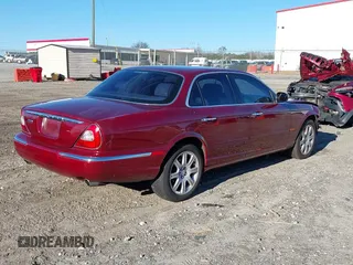 2004 Jaguar XJ VDP with VIN SAJWA74C94SG21255, listed as a IAAI auction lot 41224294 with 141,978 mi miles. Bid and sale history available at carsss.com. Image 4.