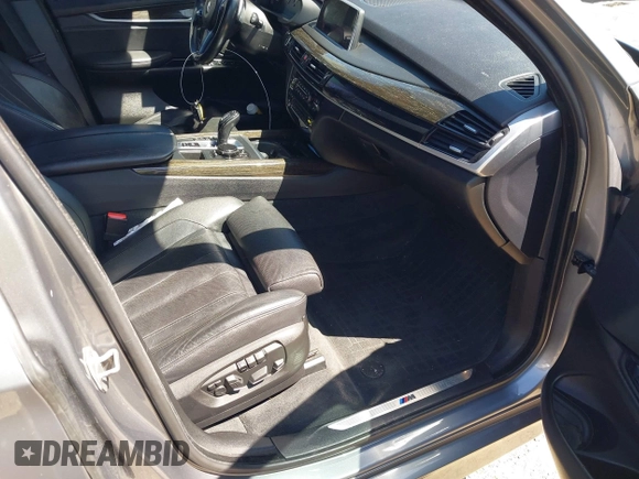 2014 BMW X5 xDrive50i with VIN 5UXKR6C57E0J72301, listed as a IAAI auction lot 39379887 with 117,012 mi miles. Bid and sale history available at carsss.com. Image 5.
