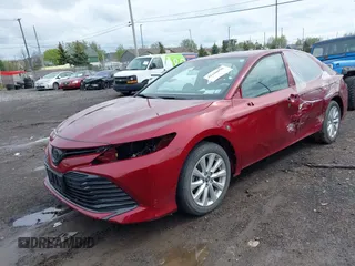 2019 Toyota Camry LE with VIN 4T1B11HK8KU823736, listed as a IAAI auction lot 42166696 with 21,732 mi miles and . Bid and sale history available at DreamBid. Image 2.