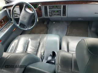 1994 Cadillac Fleetwood z VIN 1G6DW52PXRR717413, wystawiony jako Copart lot #84355464 z przebiegiem 143 507 mil mil oraz Tytuł czysty. Historia ofert i sprzedaży dostępna na DreamBid. Obrazek 8.