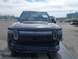 2025 Rivian R1S Adventure with VIN 7PDSGBBA5SN055497, listed as a IAAI auction lot 41695600 with 5,387 mi miles. Bid and sale history available at carsss.com. Image 13.