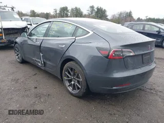 2019 Tesla Model 3 Mid Range with VIN 5YJ3E1EA3KF307415, listed as a IAAI auction lot 41673239 with 42,895 mi miles and . Bid and sale history available at DreamBid. Image 3.