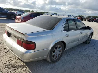 2003 Cadillac Seville Touring STS z VIN 1G6KY54923U101998, wystawiony jako Copart lot #74029304 z przebiegiem 134 157 mil mil oraz Szkoda całkowita • Salvage title. Historia ofert i sprzedaży dostępna na DreamBid. Obrazek 3.