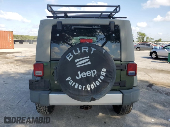 2008 Jeep Wrangler Unlimited Sahara with VIN 1J4GA59198L566019, listed as a Copart auction lot 53975965 with 184,612 mi miles and Salvage Title. Bid and sale history available at carsss.com. Image 6.