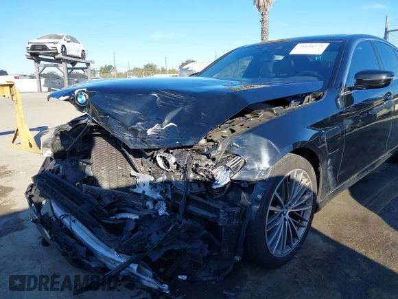 2019 BMW 5 Series 530e with VIN WBAJA9C57KB399541, listed as a IAAI auction lot 41656775 with 96,523 mi miles and . Bid and sale history available at DreamBid. Image 6.