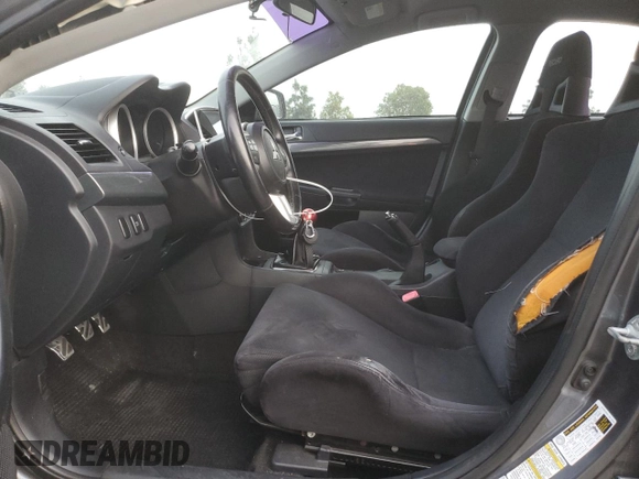 2010 Mitsubishi Lancer Evolution GSR with VIN JA32W8FV1AU027600, listed as a Copart auction lot 84328974 with 88,417 mi miles and Salvage Title. Bid and sale history available at DreamBid. Image 7.