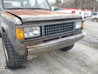 1990 Isuzu Trooper z VIN JACCH58R0L8900522, wystawiony jako IAAI lot #41642808 z przebiegiem 177 690 mil mil oraz . Historia ofert i sprzedaży dostępna na DreamBid. Obrazek 6.