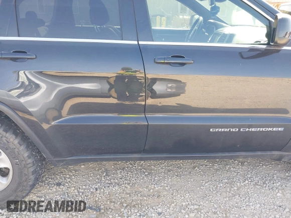 2014 Jeep Grand Cherokee Laredo with VIN 1C4RJEAG0EC442053, listed as a IAAI auction lot 42098601 with 200,982 mi miles and . Bid and sale history available at DreamBid. Image 13.