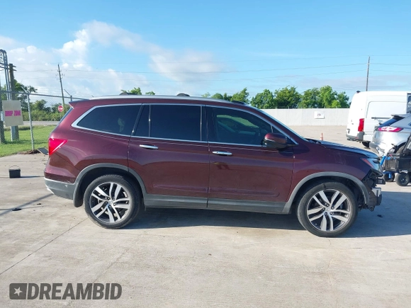 2017 Honda Pilot Touring with VIN 5FNYF5H96HB038413, listed as a IAAI auction lot 42594065 with 130,501 mi miles and . Bid and sale history available at DreamBid. Image 13.